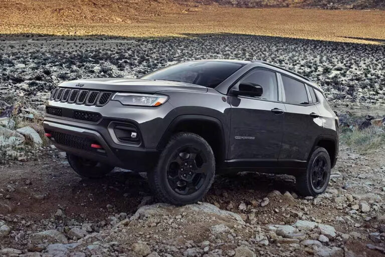 2024 Jeep Compass parked outdoors, showcasing its sleek design and rugged capabilities.